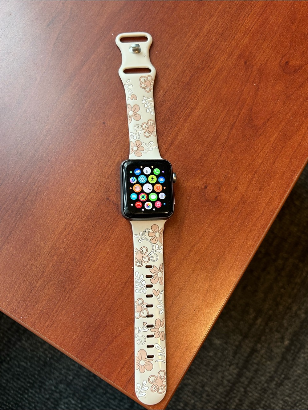 Nike branded Apple Watch with Cream Floral Silicone Band